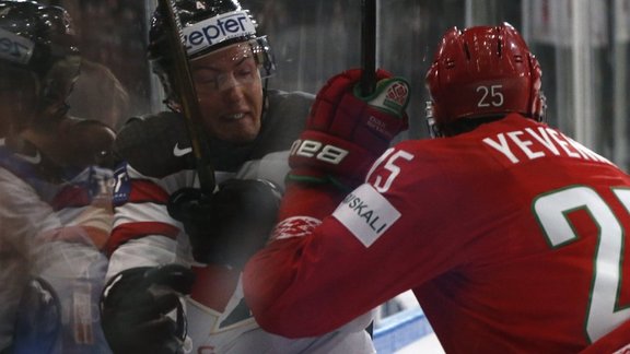 Oleg Yevenko of Belarus in action against Tyson Barrie of Canada