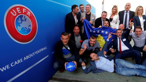 Members of the Kosovo media team celebrate 