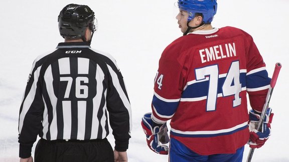 Montreal Canadiens defender Alexei Emelin with linesman Michel Cormier