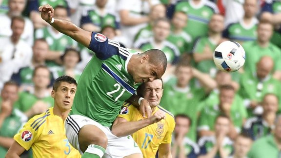 N.Ireland s forward Josh Magennis, Ukraine defender Artem Fedetskiy