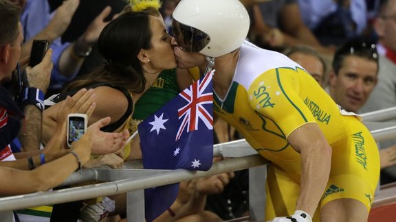 Australia Shane Perkins kisses his wife 