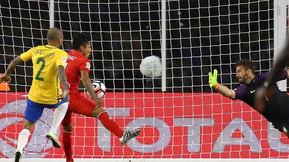 Raul Ruidiaz Peru scores handball  on Alisson Becker Brazil