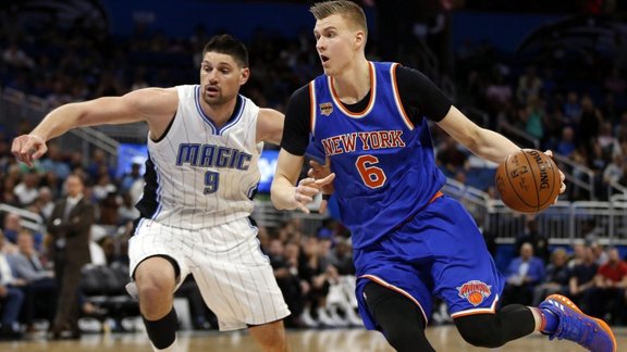 New York Knicks forward Kristaps Porzingis (6) drives past Orlando Magic center Nikola Vucevic