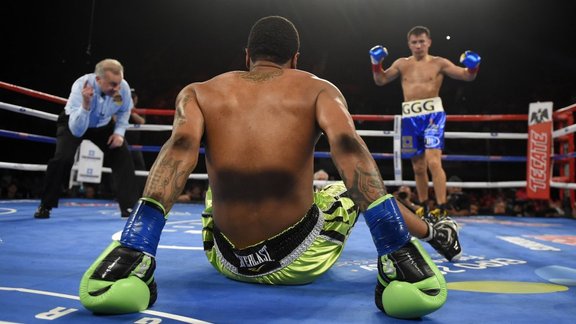 Gennady Golovkin of Kazakhstan knocks down Dominic Wade