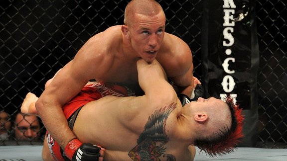  UFC fighter Georges St-Pierre (top) battles Dan Hardy