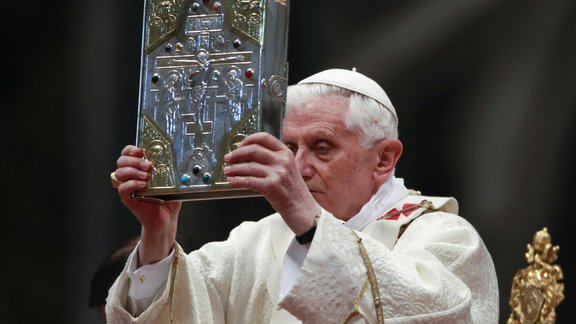 Pope Benedict XVI holds the book of the gospels