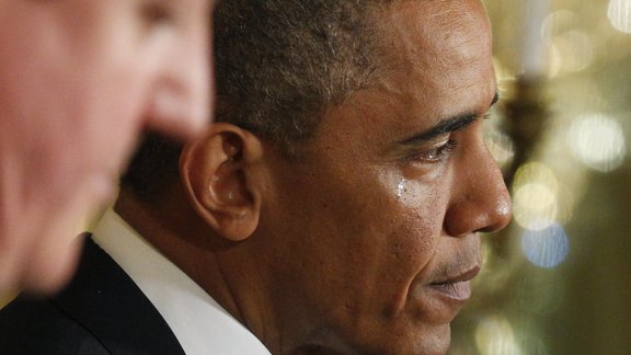 A tear runs down the face of U.S. President Barack Obama as he answers questions about the attack on the U.S. embassy in Benghazi