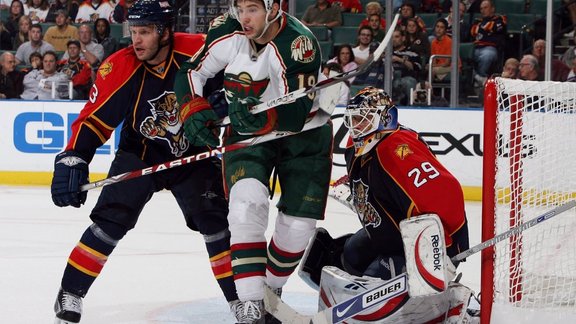 Karlis Skrastins and goaltender Tomas Vokoun Florida Panthers against Colton Gillies