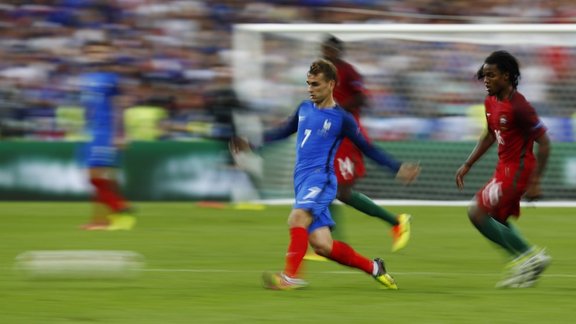 France s Antoine Griezmann in action with Portugal s Renato Sanches 