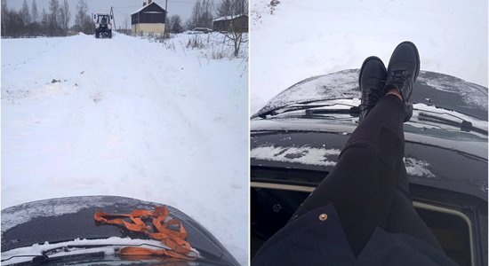 ВИДЕО: Машина застряла в снегу под Балви, хозяйка смогла выбраться только через люк