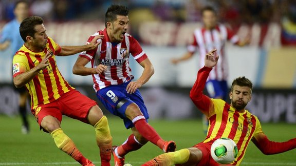 Gerard Pique and David Villa (Barcelona - Atletico)