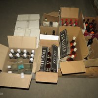 Foto: Pabeigta izmeklēšana par alkohola realizāciju; izņemtas gandrīz 12 000 pudeles
