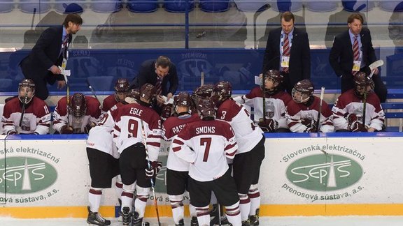 Latvia's U-18 players around head coach Igors Smirnovs 2017 IIHF World Championship