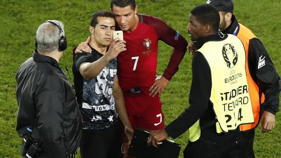 Portugal Cristiano Ronaldo poses for a selfie with fan