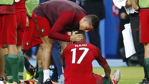 Portugal s Cristiano Ronaldo speaks to Nani