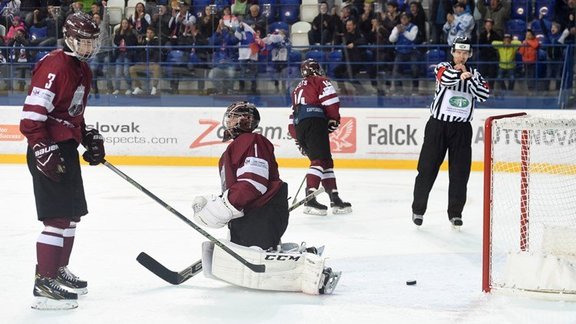 Latvia U-18 goalie Janis Voris and Renars Karkls #3 