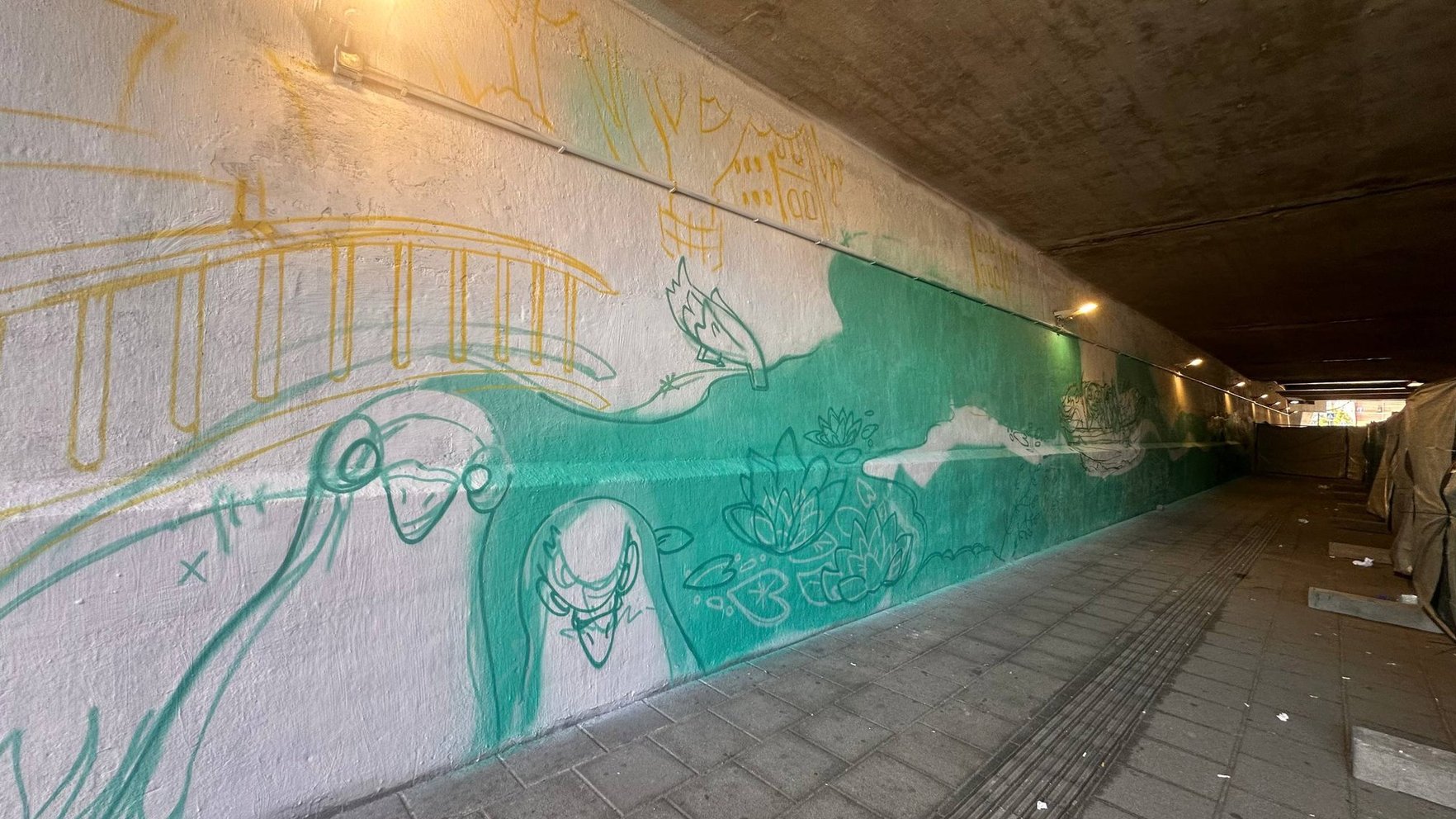 Tunelī pie Centrāltirgus top jauns mākslas darbs – murālis "Rīgas Atlantīda"