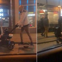 Video: Rīgas ielās tēvs bērnu ratiņus stumj ar elektrisko skrejriteni; policija lūdz atpazīt vīrieti