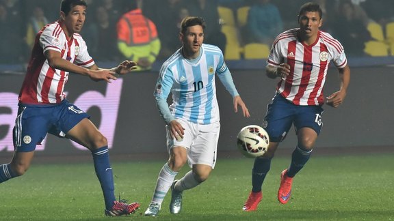 Argentina forward Lionel Messi with Paraguay