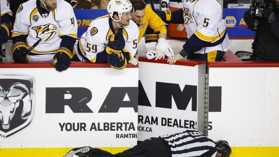 linesman Don Henderson after he was hit by Calgary Flames Dennis Wideman 