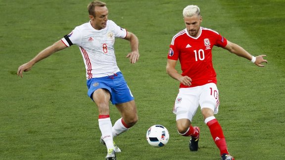 Russia s Denis Glushakov and Wales Aaron Ramsey