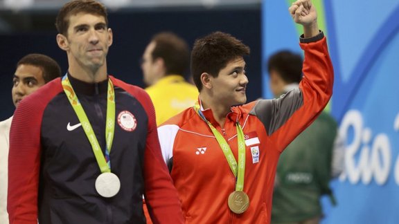 Joseph Schooling of Singapore celebrates win to Michael Phelps (USA)