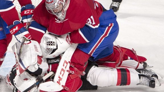 Montreal Canadiens Carey Price punches New Jersey Devils Kyle Palmieri 