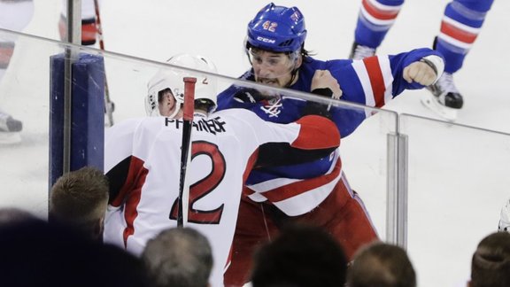 New York Rangers Brendan Smith (42) and Ottawa Senators Dion Phaneuf