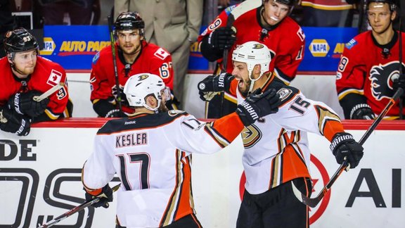 Anaheim Ducks Ryan Getzlaf and Ryan Kesler in front of Calgary Flames bench