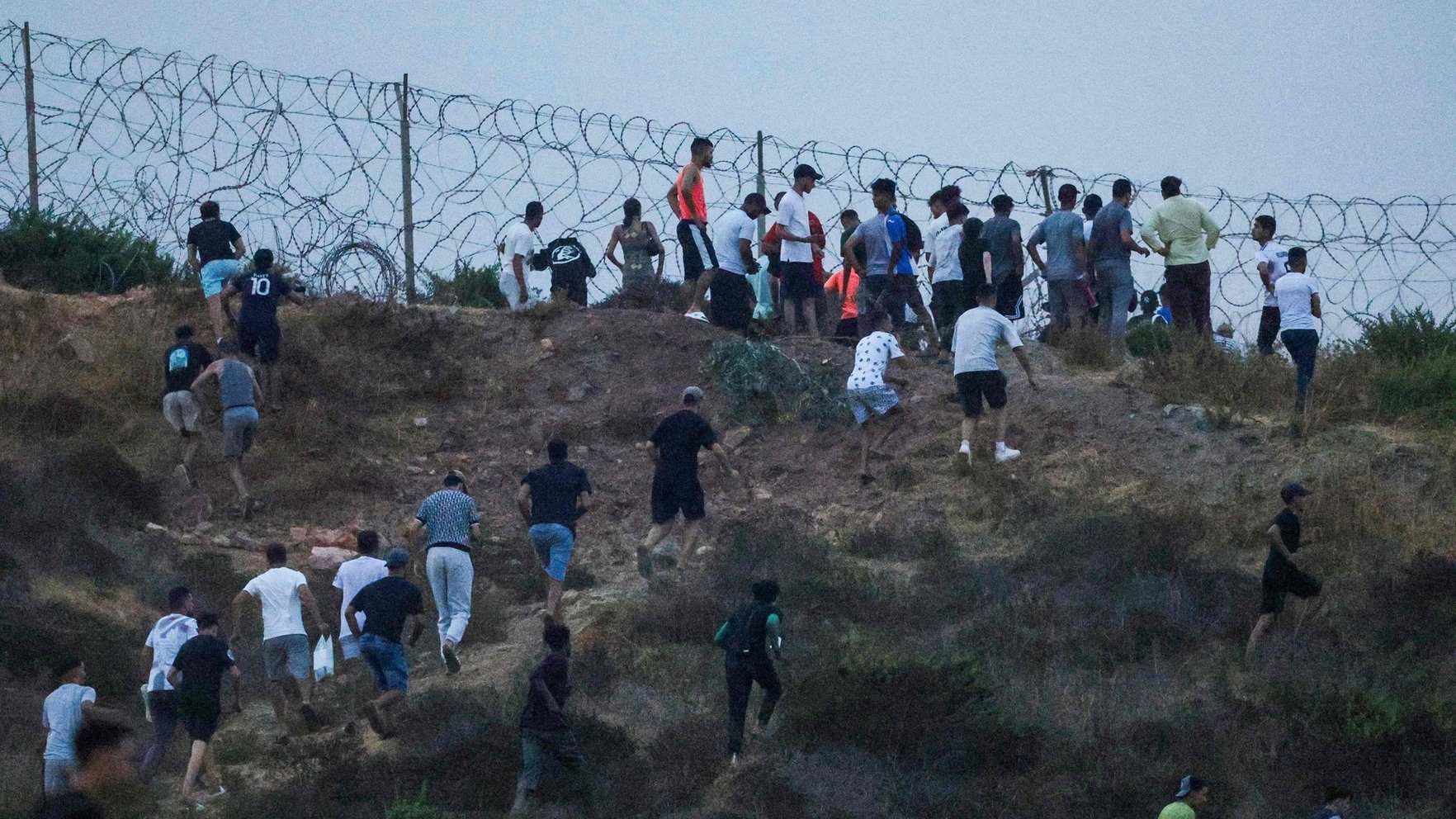 Thousands breach Spain's Ceuta enclave; White House cites event in anti-immigration defense