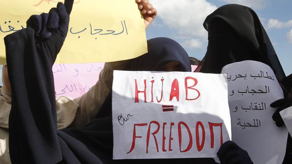 Female protesters dressed in hijabs