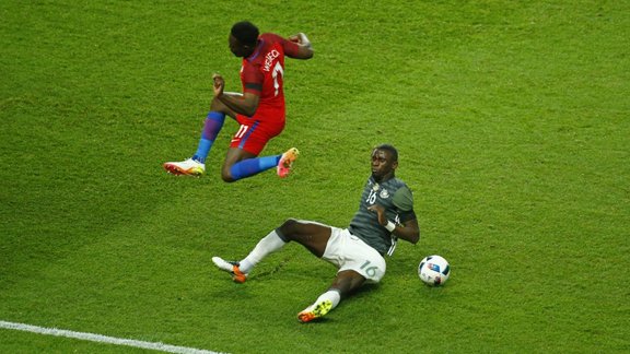 Germany s Antonio Rudiger in action with England s Danny Welbeck 