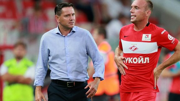 head coach Dmitry Alenichev, left, and player Denis Glushakov