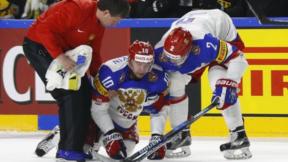 Sergei Mozyakin of Russia sustains an injury