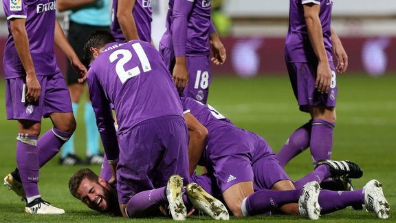 Real Madrid Nacho Fernandez (bottom) celebrates fantastic goal