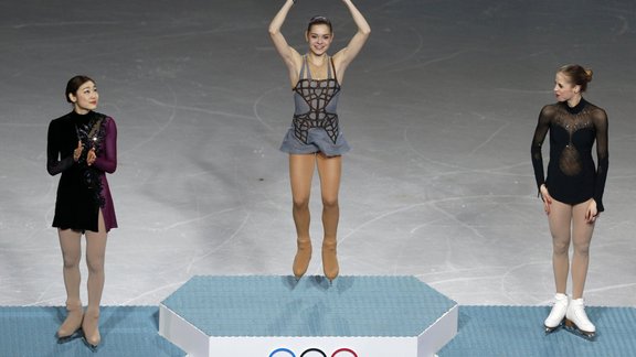 South Korea s silver medalist Kim Yu-Na, Russia s gold medalist Adelina Sotnikova and Italy s bronze medalist Carolina Kostner 