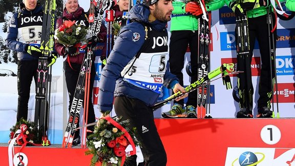 France Martin Fourcade leaves podium