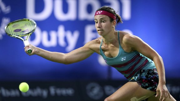 Anastasija Sevastova returns ball to Wozniacki 