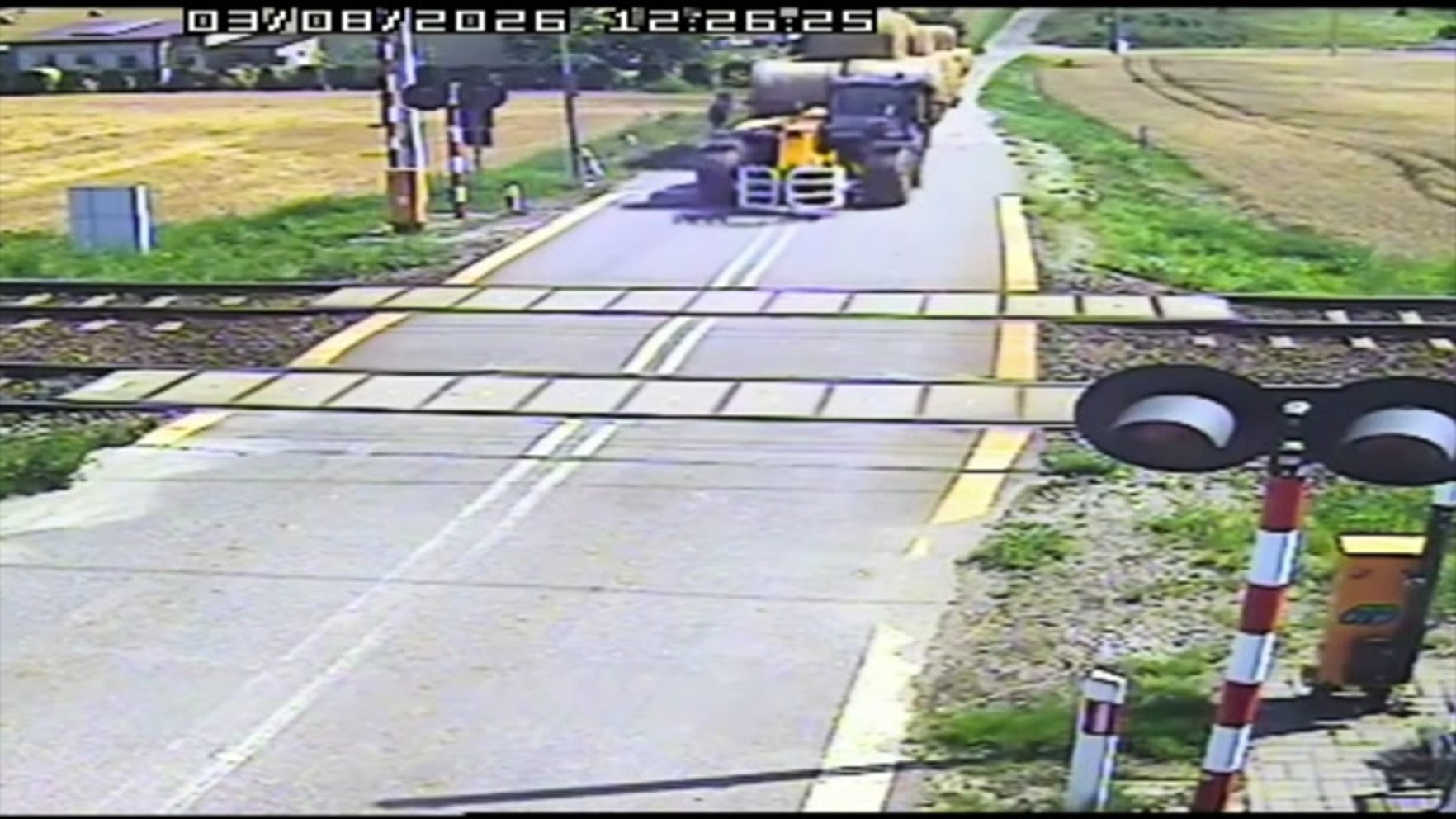 Video: Train hits tractor trailer loaded with hay bales in Poland