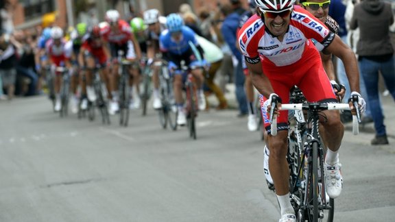 Italian cyclist Giampaolo Caruso (2nd R) of Team Katusha and Italian cyclist Domenico Pozzovivo of AG2R La Mondiale