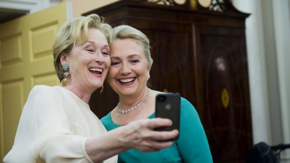 Meryl Streep takes a photo of her and Secretary of State Hillary Clinton