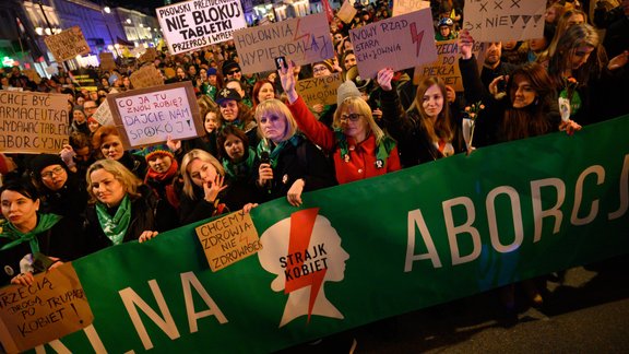 Pro-Abortion Demonstration In Warsaw. Demonstrators hold signs and shout slogans as they take part in a rally in favour 