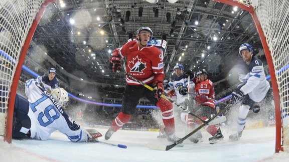 Connor McDavid of Canada scores a goal past goalkeeper Mikko Koskinen of Finland