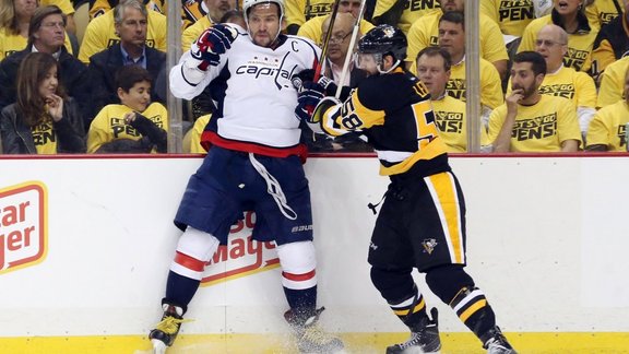 Pittsburgh Penguins Kris Letang checks Washington Capitals Alex Ovechkin