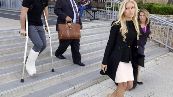 os Angeles Kings player Slava Voynov, left, leaves court in Torrance, Calif., with his wife, Marta Varlamova,