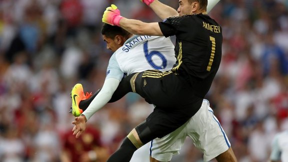 England Chris Smalling with Igor Akinfeev 